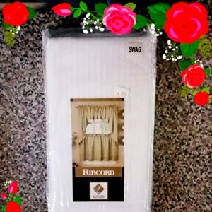 Ripcord swag curtains.